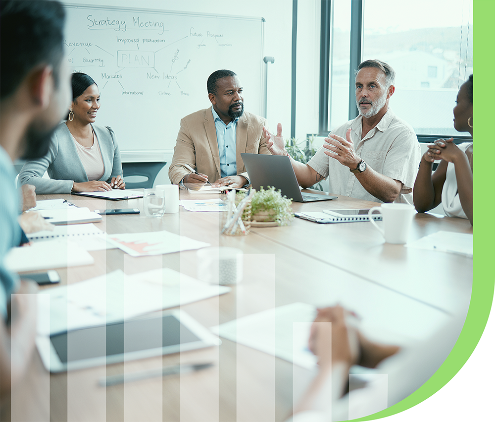 hcrm group of employees in office meeting room discussing healthcare predictions, risk management, and staying ahead of rising costs of healthcare